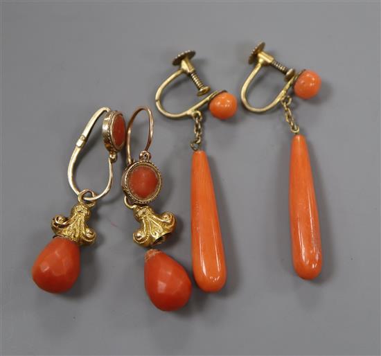 A pair of yellow metal and coral drop earrings and a similar pair of ear clips